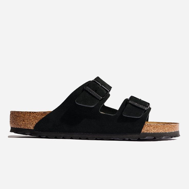 Black sandal with cork sole on a white background