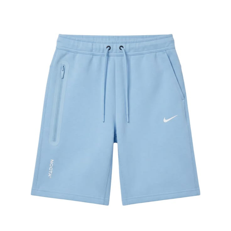 Light blue Nike athletic shorts with a white swoosh logo on the left thigh, featuring a drawstring waist and zippered side pocket, shown on a plain white background.