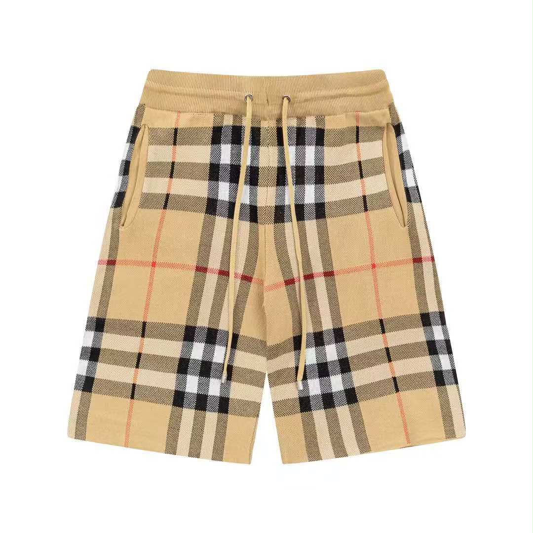 Beige plaid shorts on a white background