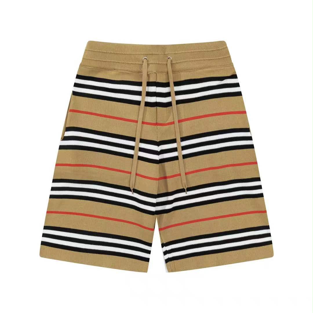 Beige shorts with black, white, and red stripes on a white background