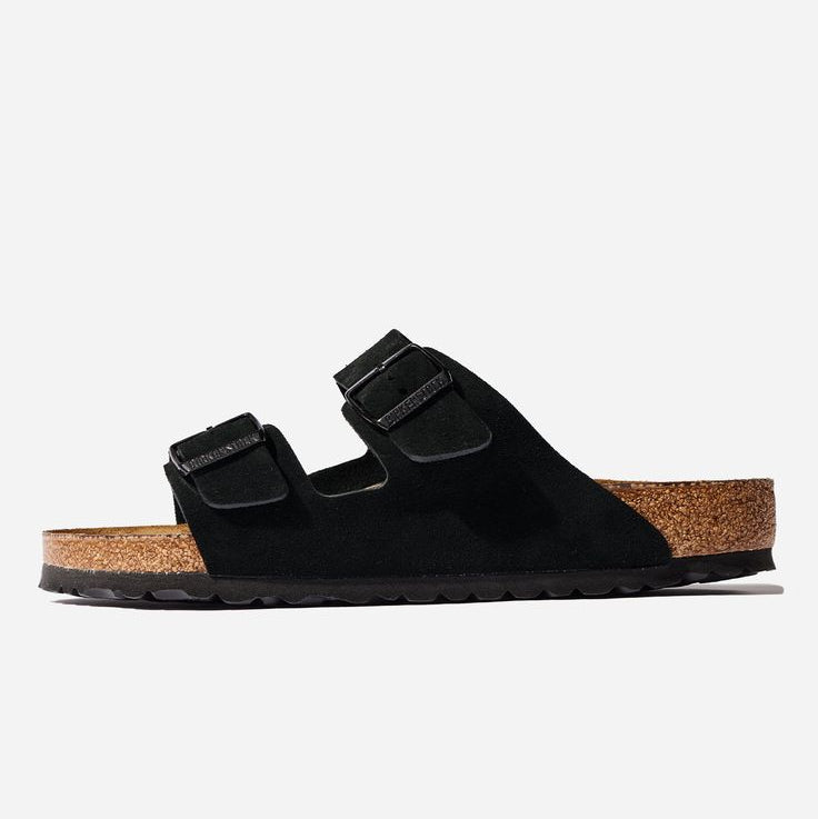Black sandal with cork sole on a white background