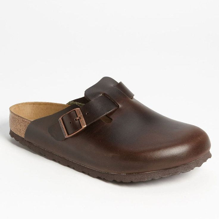 Brown leather clog shoe on a white background