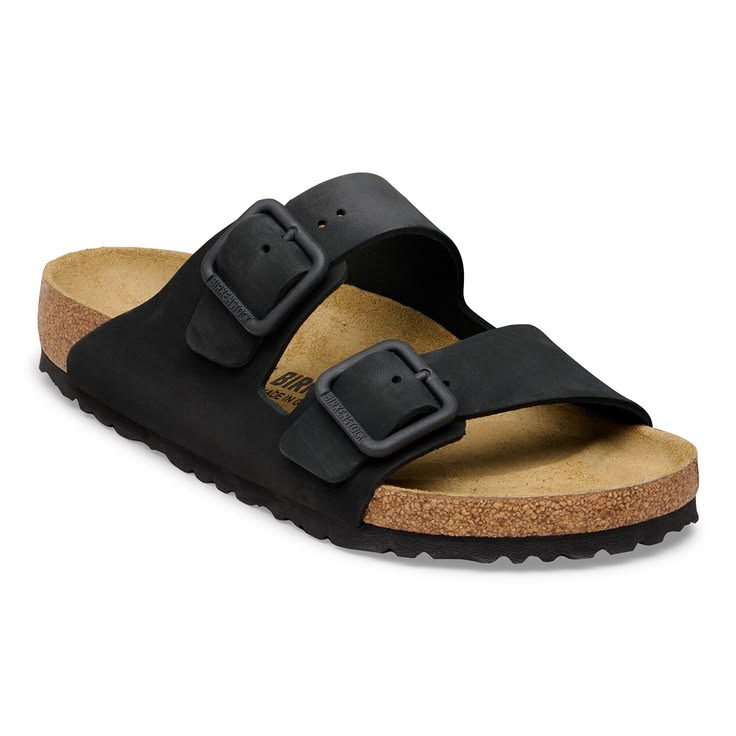 Black sandal with cork sole on a white background