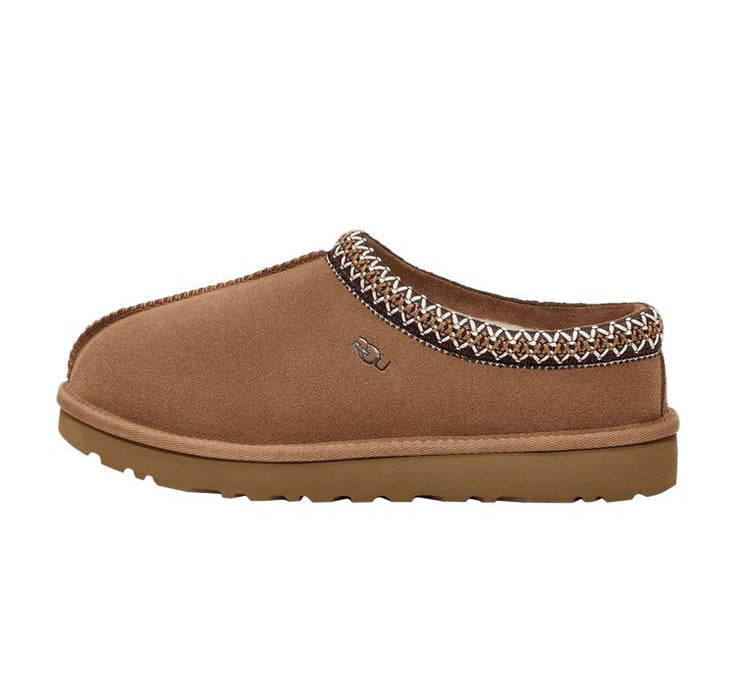 Brown slipper with decorative pattern on a white background