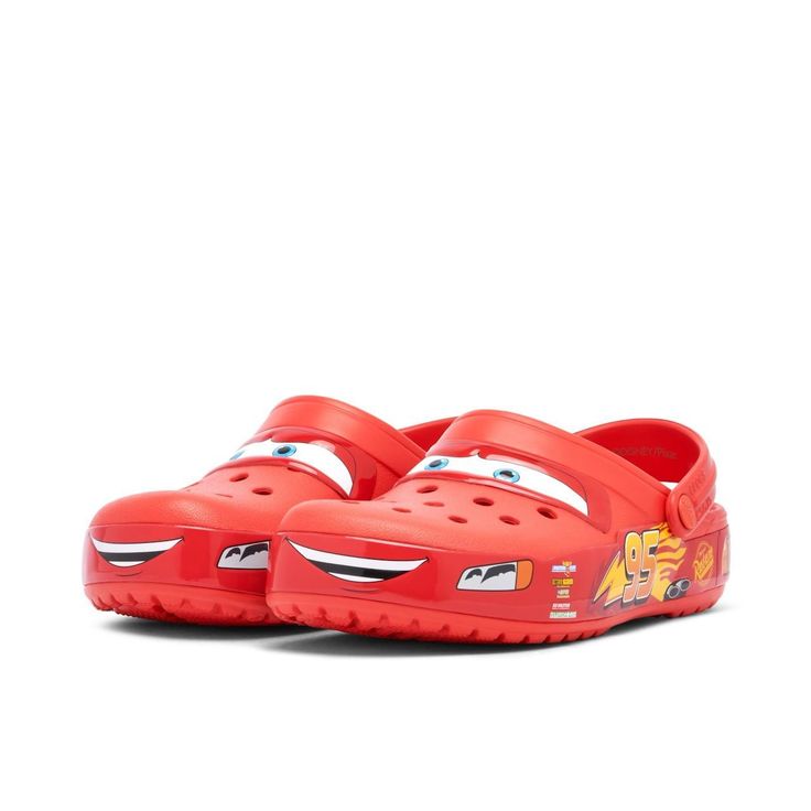 Red children's shoes with character design on a white background