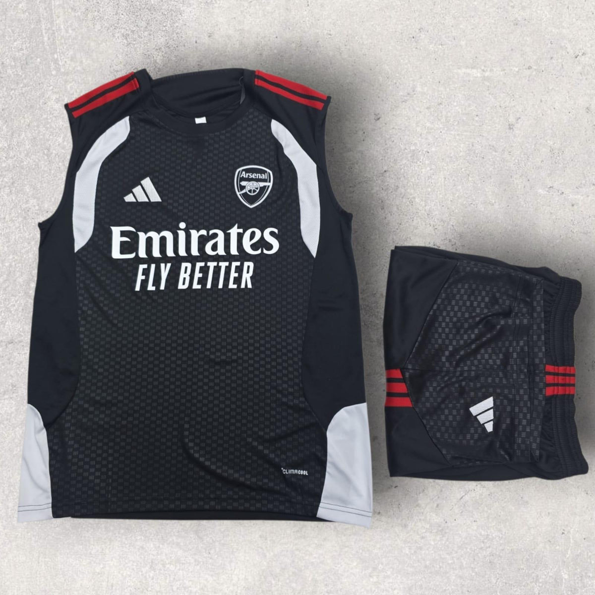 Arsenal Black Sleeveless Training Set – Orange Trim Vest & Shorts
