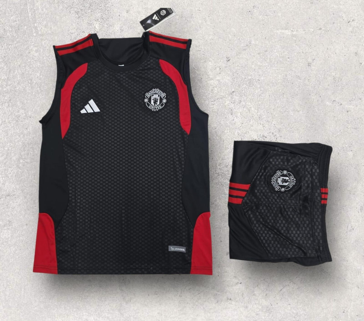 Manchester United Black Sleeveless Training Set – Red Trim Vest & Shorts