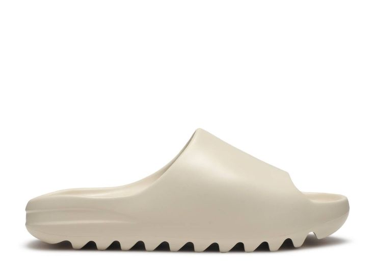 White sandal with black sole on a white background