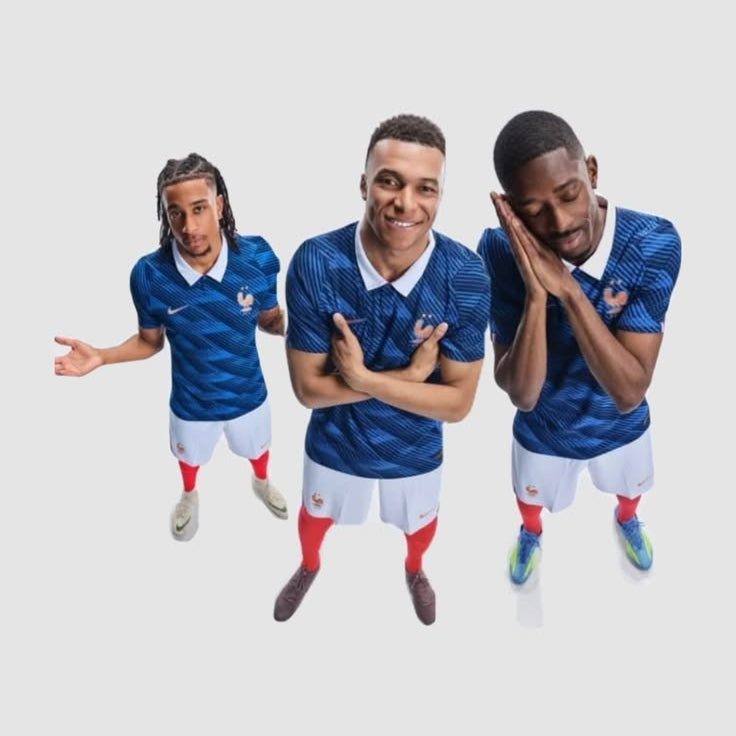 Three men wearing matching blue patterned soccer jerseys, white shorts, and red socks, posed against a plain light gray background.