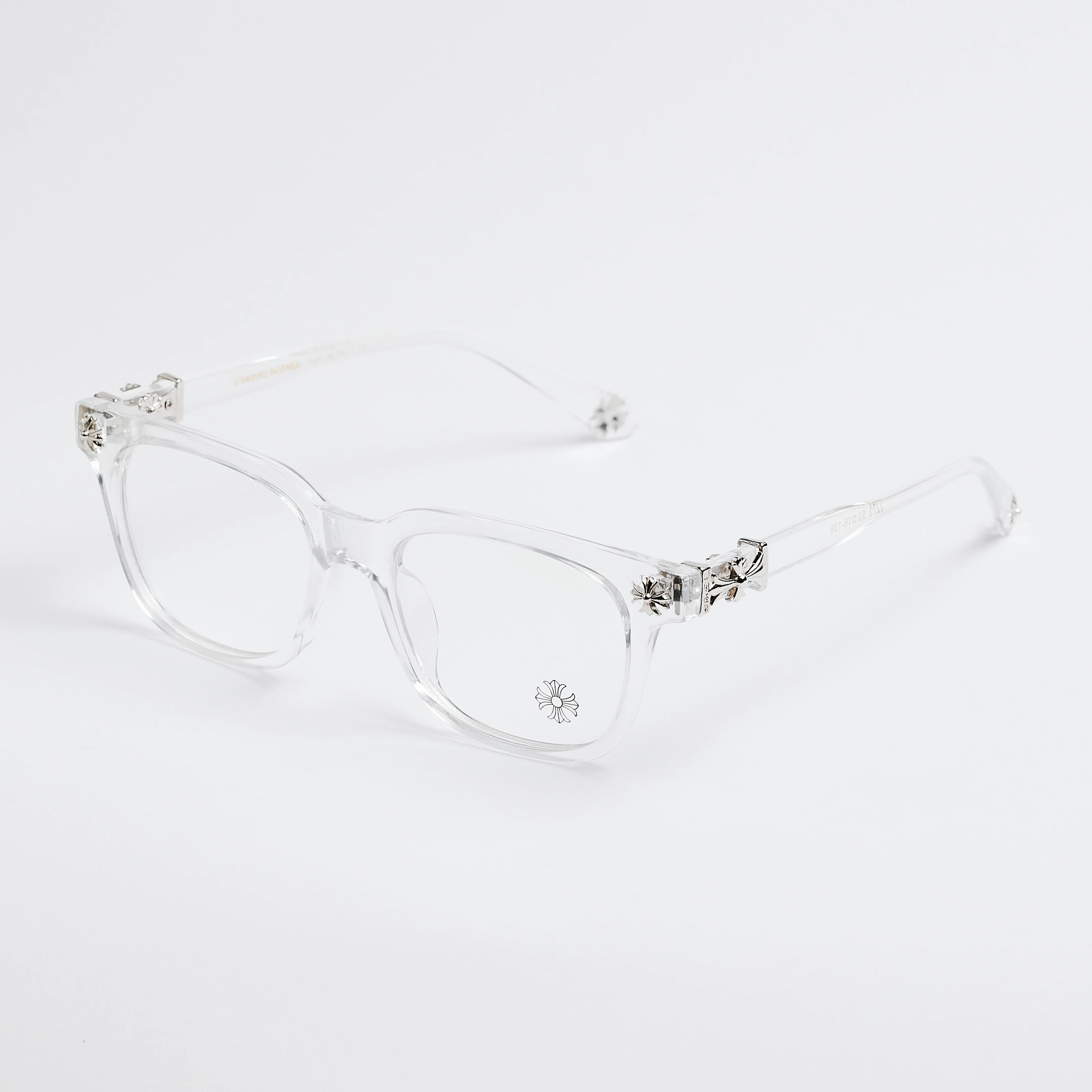Clear eyeglasses with decorative elements on a white background